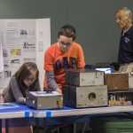 Visitors Examine the Historic Equipment